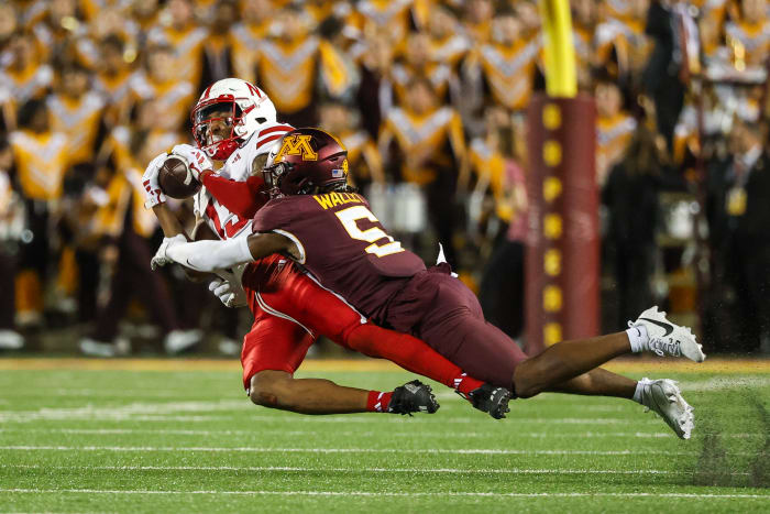 Nebraska Minnesota 2023 - Marcus Washington stopped by Minnesota defensive back Justin Walley